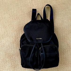 Calvin klein backpack, black, 5 pockets, 3 inside 2 outside. Light weight.